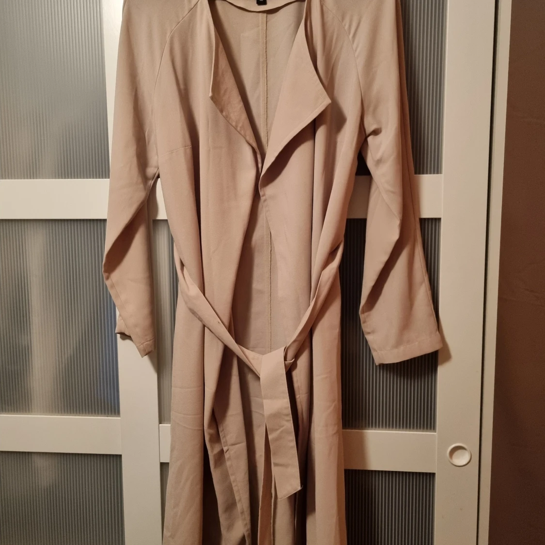 Kavaj jacka med knytskärp