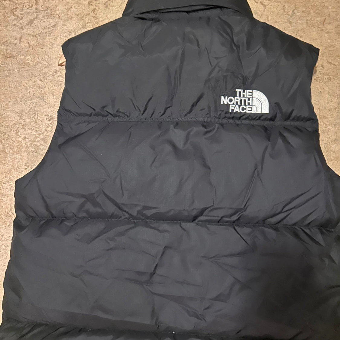 Svart dunväst från The North Face - 90