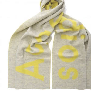 Acne halsduk  - Halsduk från Acne Studios i limegul och grått. Logga över hela.