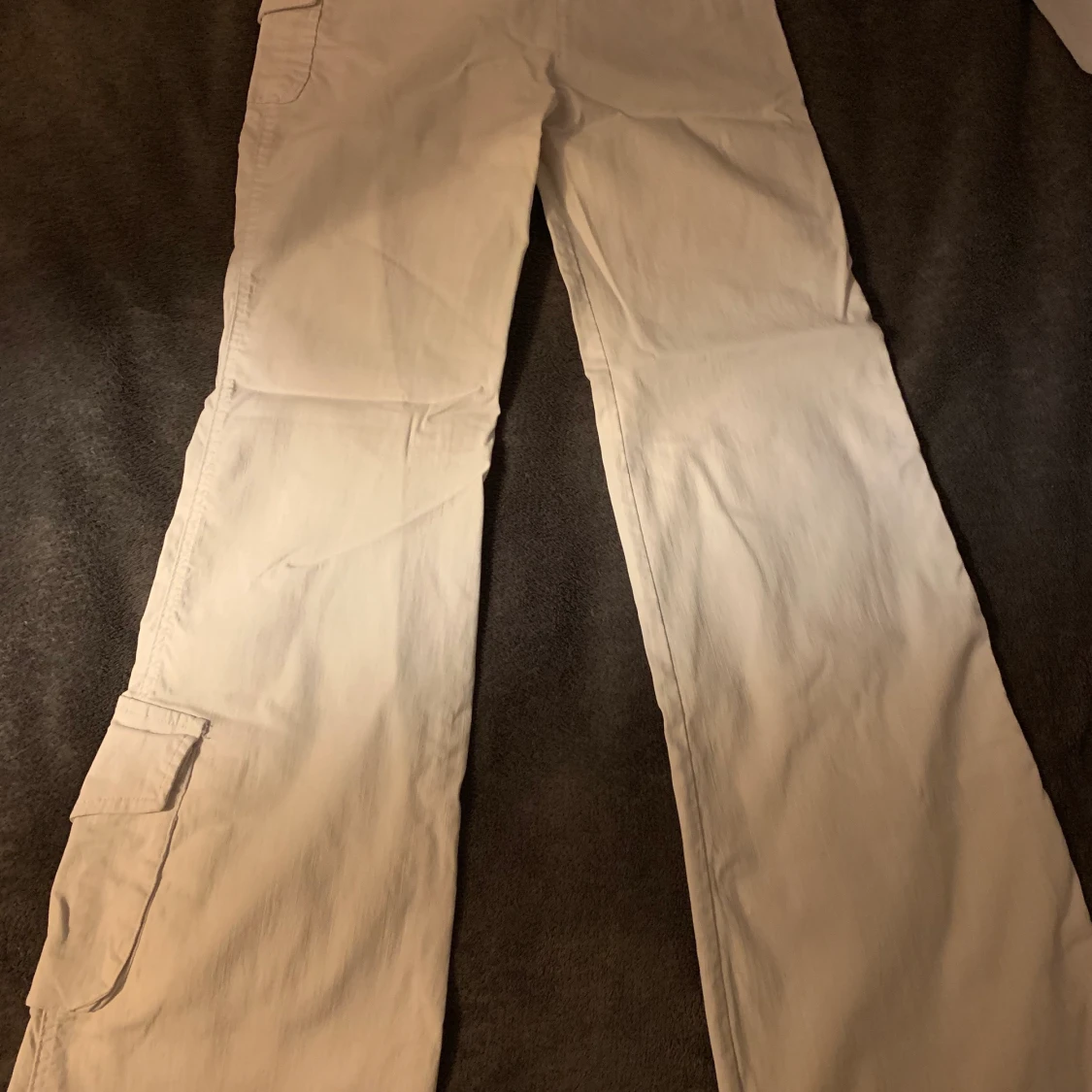 Utsvänga byxor med fickor. Str 25 - 90