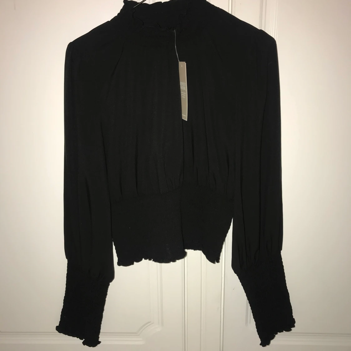 Svart blus i storlek 36 - 90