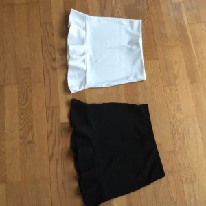 Volang kjol vit och svart - Fina volangkjolar i vit och svart. Perfekt till sommaren. Köparen står för frankt. 