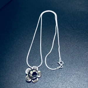  - Silver jewellery 925 Sterling Silver Necklace Chain Snake Chain style   ( new condition 👍)  Silver Necklace Sweet  design  🌺 handmade as a Lanna native handmade.  is unique, beautiful and elegant.  * 925 sterling Silver  Chain  41 cm(16") 2mm  Snake Chain style   Please select your length of  16, 18  ,20  * Materials :  sterling silver 925 ,925  silver *  * Chain style : Snake Chain style   * Clasp/ Closure : spring ring clasp and jump ring which  are also Sterling Silver  * includes  Zipper Jewellery pouch  * 🛍  * ship worldwide from Thailand  📦✈️ free ship with register  mail    Your necklace will arrive in a  Zipper Jewellery pouch ready for giving as a gift  or for using to store your necklace.    