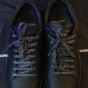 Saint Laurent lip sneakers  - Använda två gånger storlek 41 köpts från saint laurent. Ny pris 7000