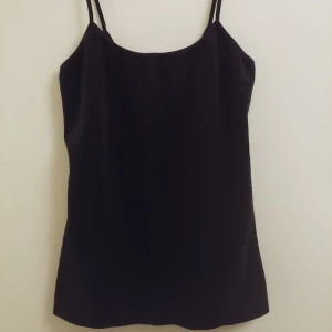  - Black velvet top, it has a low back and elastic stripes. Calvin Klein original.   *Normal shipping is included in the price. 