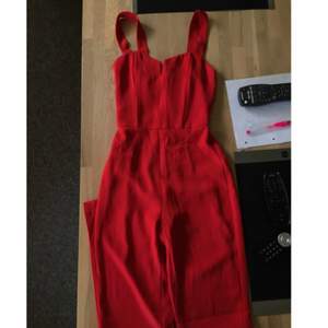 Red pantsuit Never used Size 34  Place bid