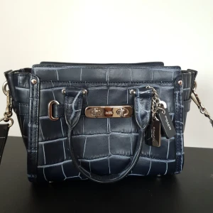 Coach croc embossed swagger crossbody bag - Unused coach crossbody bag, bought in US from century21. Leather. 20cmL 17cmH 9cmW
