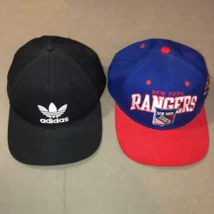 Kepsar adidas/newyork rangers - En svart adidas keps använt skick! One size på adidasen! New york rangers använt skick! Båda har ”knäppband” bak så man kan justera den. Båda tsm för 100kr annars 60kr styck:)) tar swish