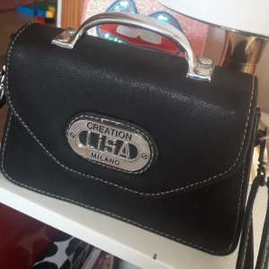  - Skit snygg retro väska .fint skick.