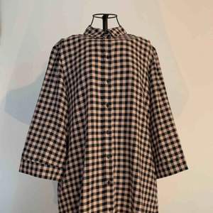 Long checked shirt dress. Size M. New, with tags