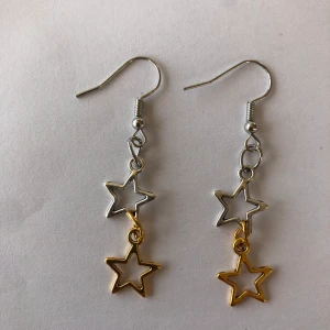 Örhänge - Ett snyggt egengjord örhänge i guld och silver. 10% går till att rädda sköldpaddor. Gratis frakt