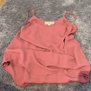 Pink silk blouse - It has adjustable straps and double layered fabric