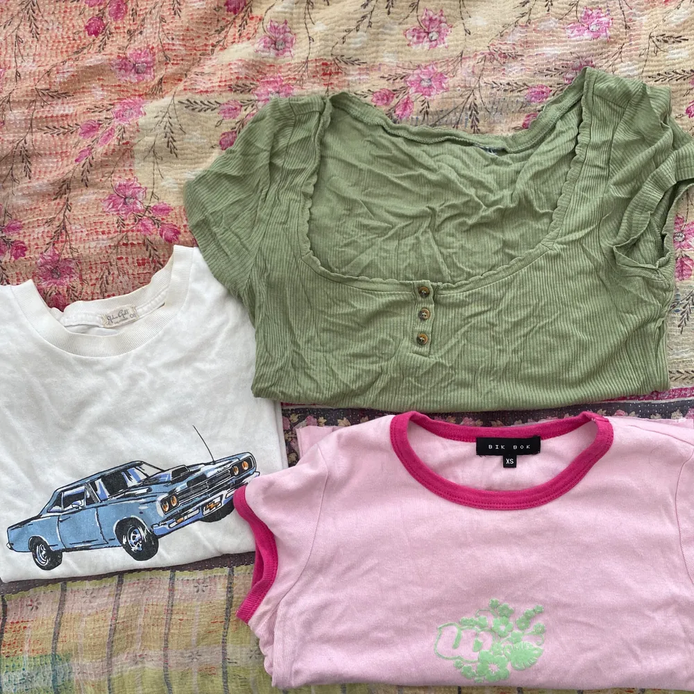 three great t shirts. the car and pink shirt are for sale individually on my page already. i’ll pay for the shipping. . T-shirts.
