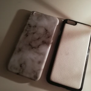 Mobilskal för iPhone 6/6s - Det svarta skalet har en liten fläck på sig. 