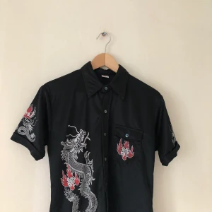 Dragon Shirt  - Bought from a second hand store, super good quality by the brand “TURN IT ON” 
