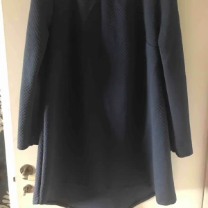  - Handmade dress with liner around neck and goes wider to the bottom.