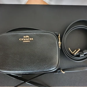 Coach crossbody/belt bag leather in black - Rarely used crossbody and belt bag by Coach. Pebbled leather , bought in US from Coach store 18cmL 11cmH 5cmW