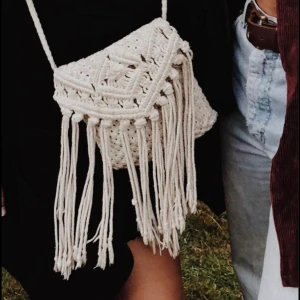 Crochet white purse  - Beautiful crochet purse handmade in Bali! It has a long shoulder strap and a zip to hold everything in. Great condition! 