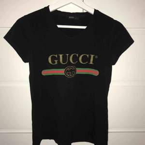 Gucci T-shirt.