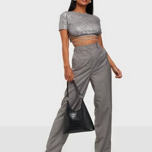 Motel topp storlek S - Säljer skitsnygg glittertopp från Motel rocks i storlek S använd 1 gång! 