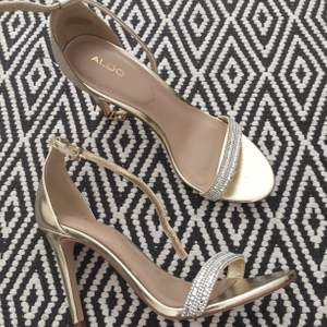 Beautiful and elegant stilettos from Aldo in gold with diamond details .worn once  at indoor occasion.