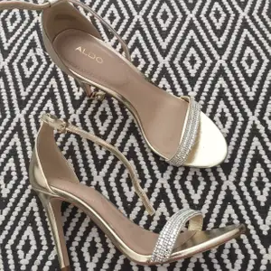 Beautiful and elegant stilettos from Aldo in gold with diamond details .worn once  at indoor occasion.