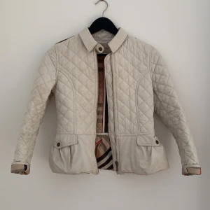 Burberry Jacket - A Burberry jacket in perfect condition that has barley been used. 