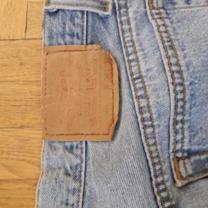  - Levi's 501 jeans in light blue. They are bought second hand in UK 14 and are sold because they are too big. Very good condition.