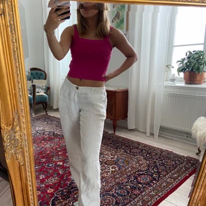 rosa linne från HM I strl. XS - Ett rosa tunt stickad linne från hm i strl. XS. Större i storleken och passar även strl. S.