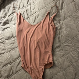 Body  - En rosa body linne i storlek XS 🤗