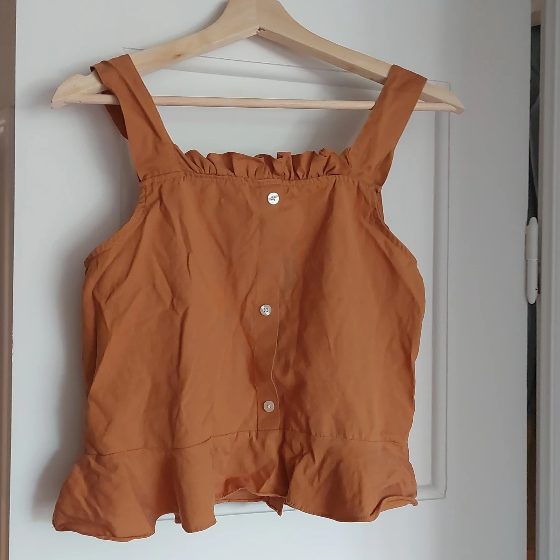 Gullig topp i storlek S