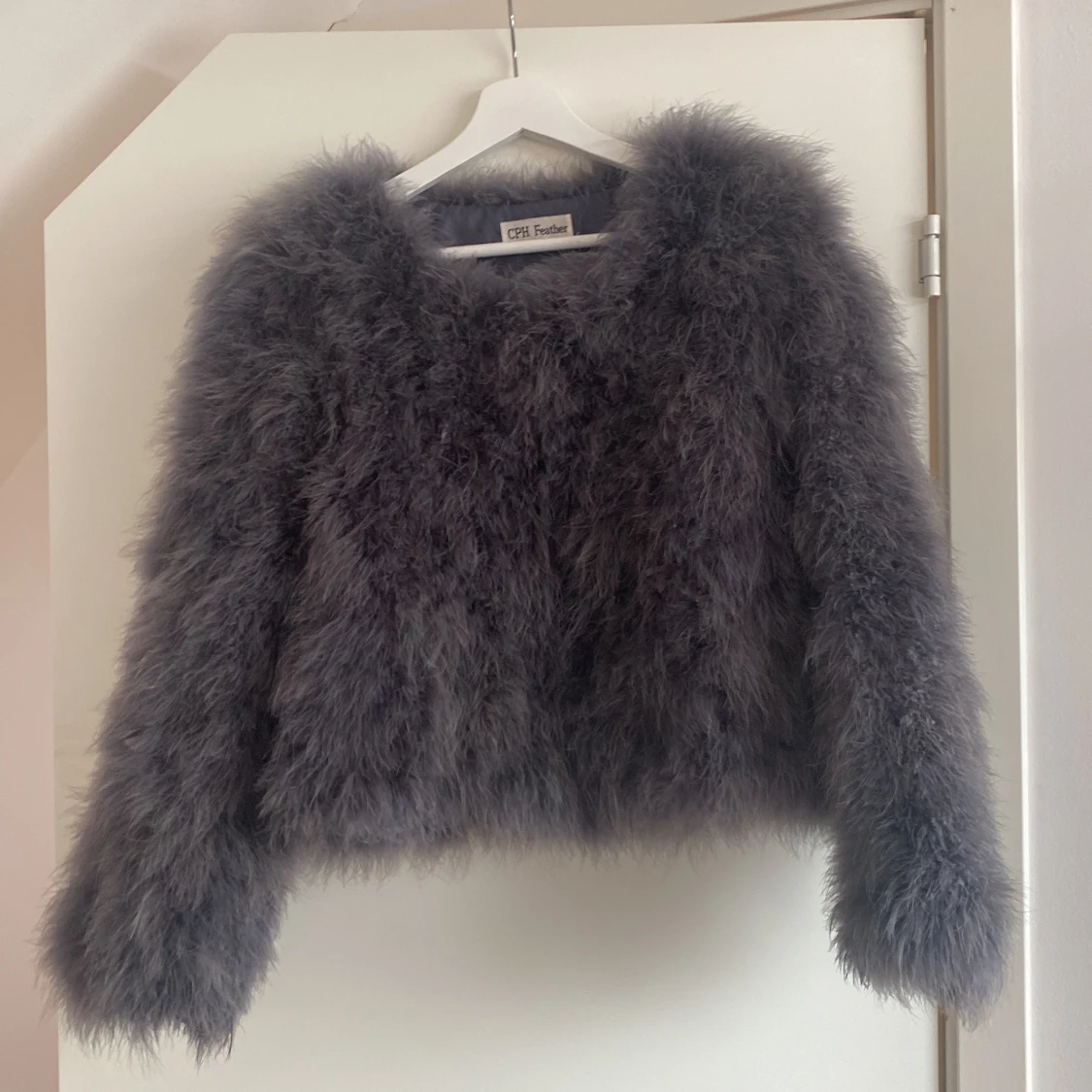 Äkta strutspälsjacka