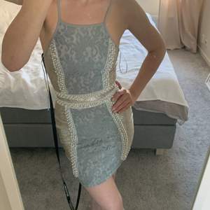 Beautiful mini dress with lace and pearls. Long silver zipper on the back. Perfect for date/wedding/ night out/party. New with tags . Size 34(UK4). Pretty Little Things. More pics on request.