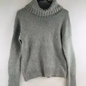 Grey knitted turtleneck with a thick neck. Very warm and comfy!