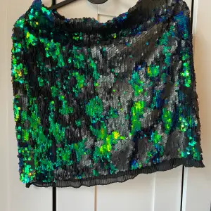 Party mini skirt with beautiful sequins. Worn once only. Size L but it fits M too. I am Medium size 