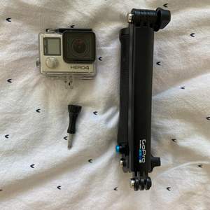 Slightly used GoPro 4 with selfie stick and case for using it under water. 