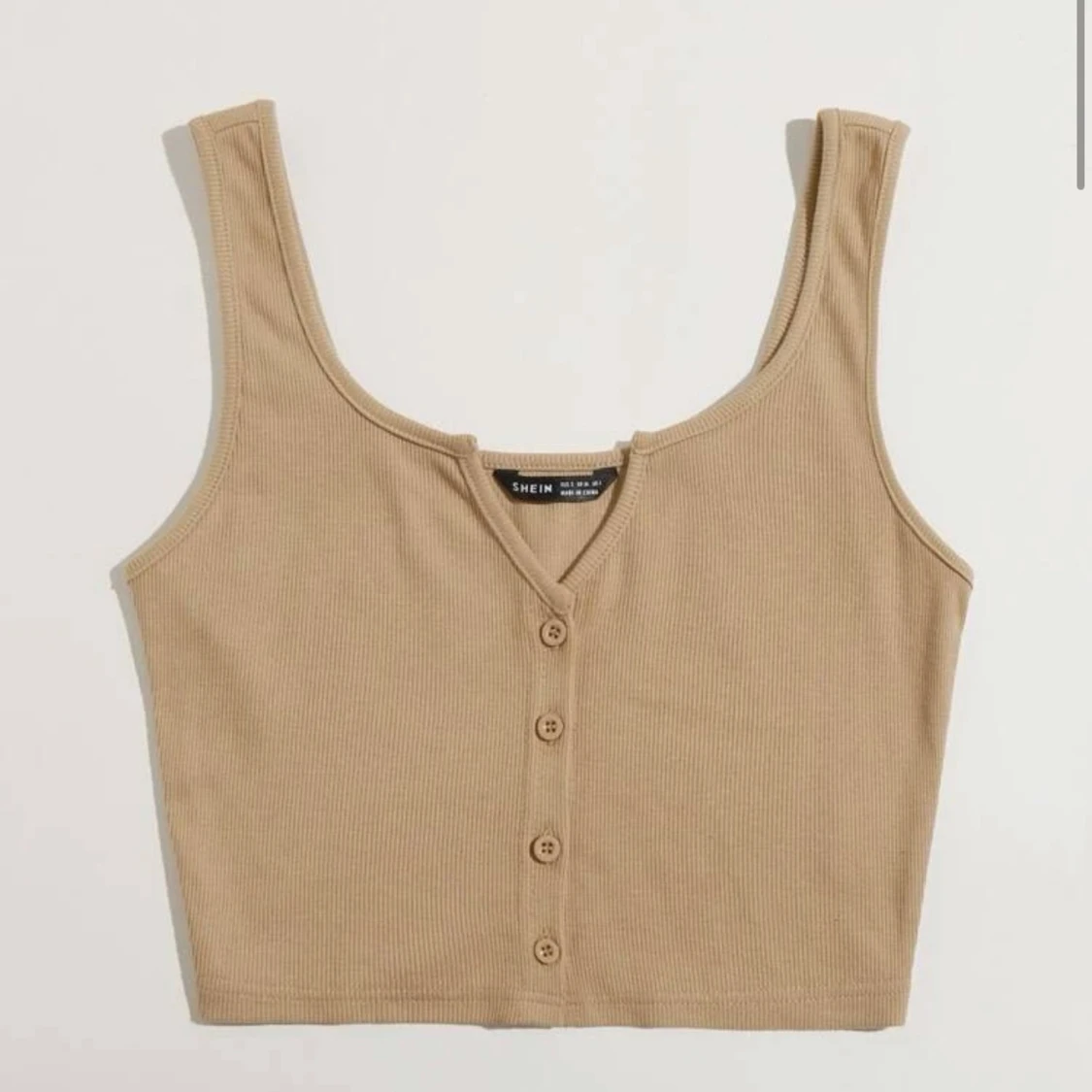 Beige linne med knappar