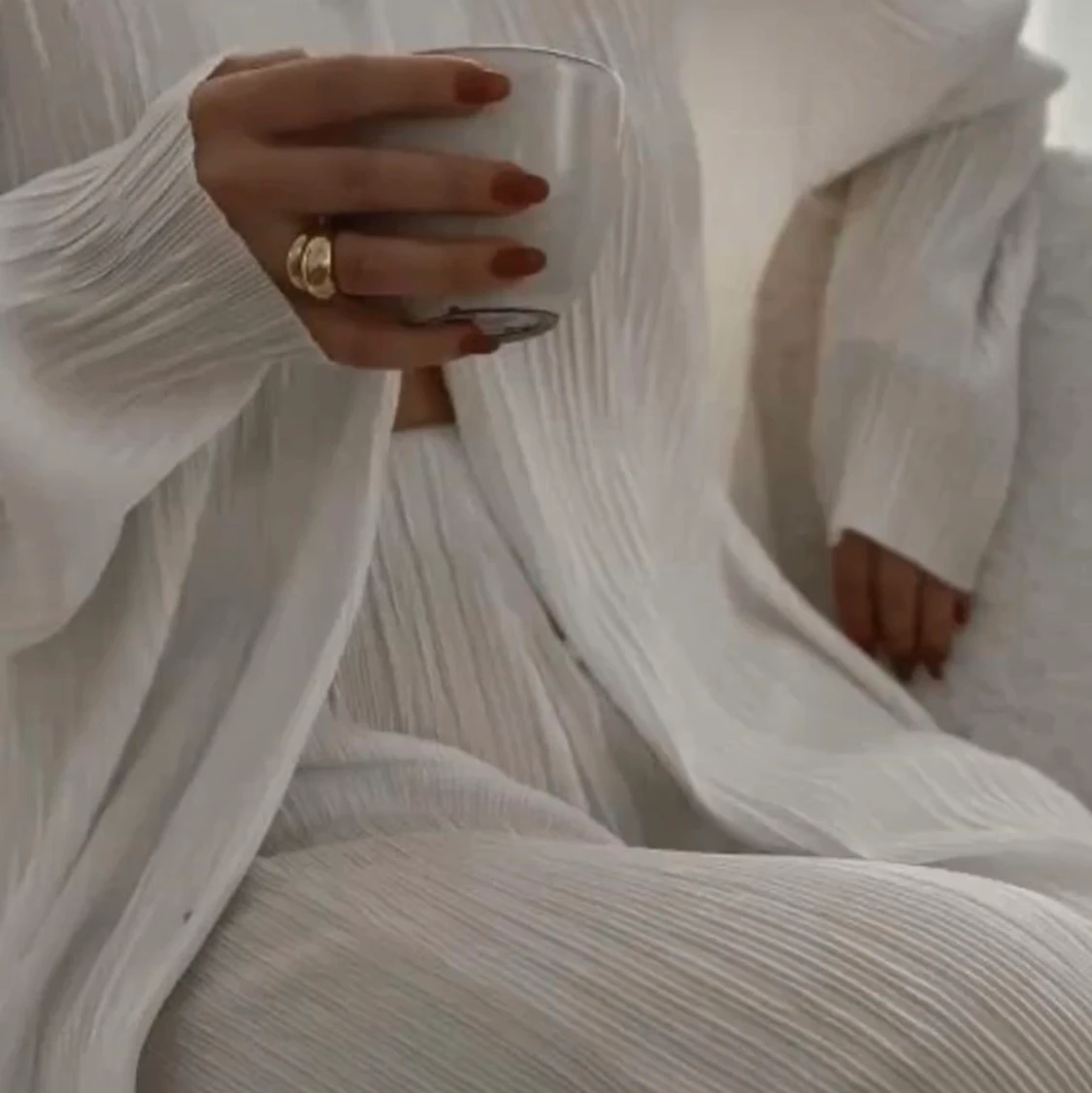 Vita plisserade byxor