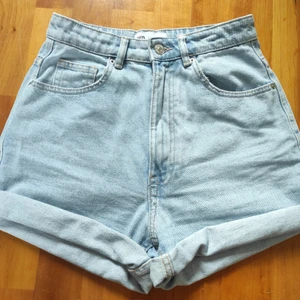 Denim shorts  - High-waisted, light blue, denim shorts.