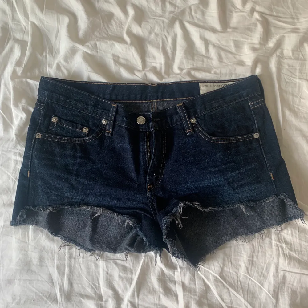 Rag & bone shorts in dark denim in size 27. I would say they are low-rise. I’ve worn them a couple of times, no signs of wear and tear.. Shorts.
