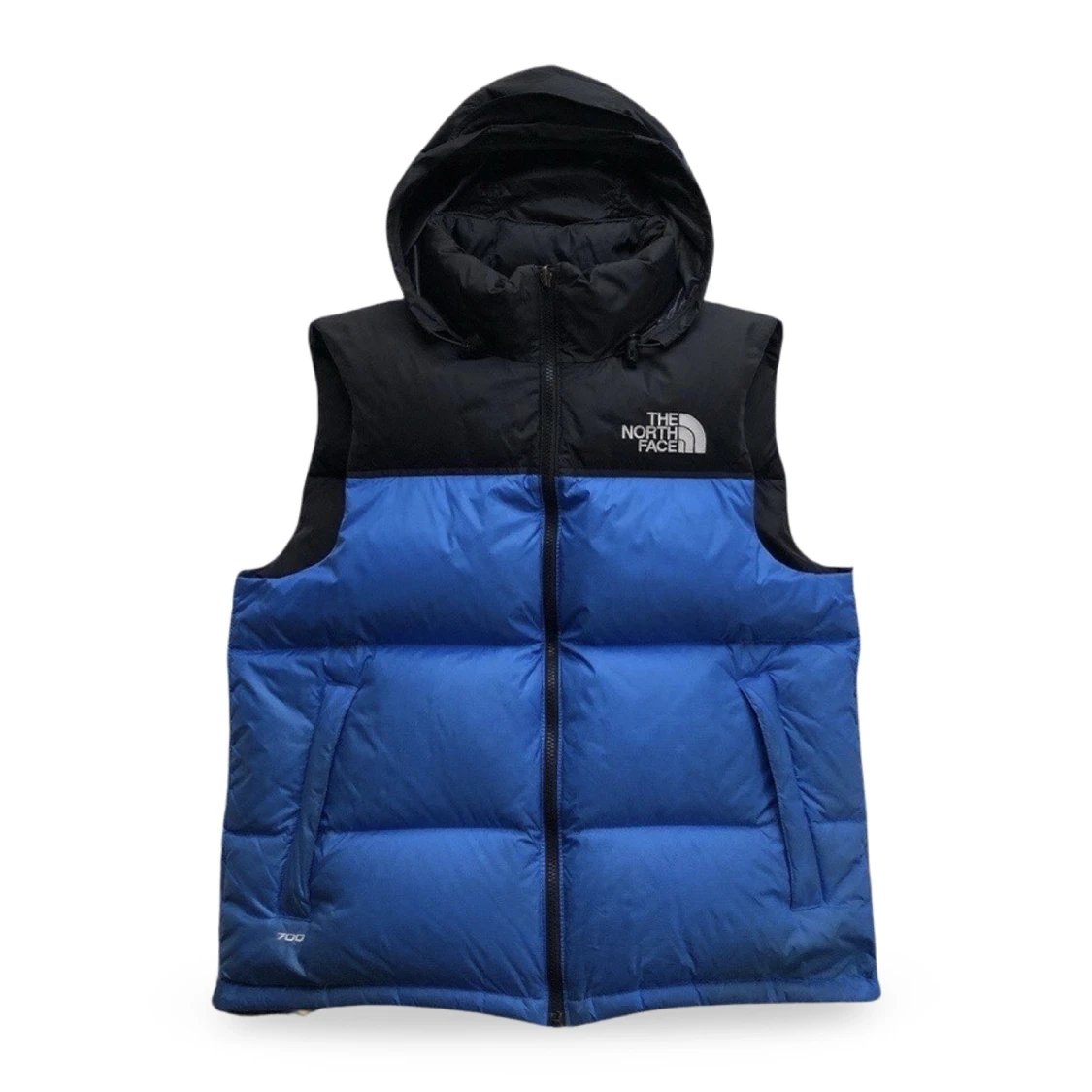 Blå och svart dunväst från The North Face