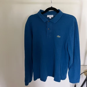 Långärmad Lacoste piké  - Storlek M bra skick