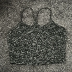 Svart grått linne - Svart grått linne med band som går ihop i ryggen 