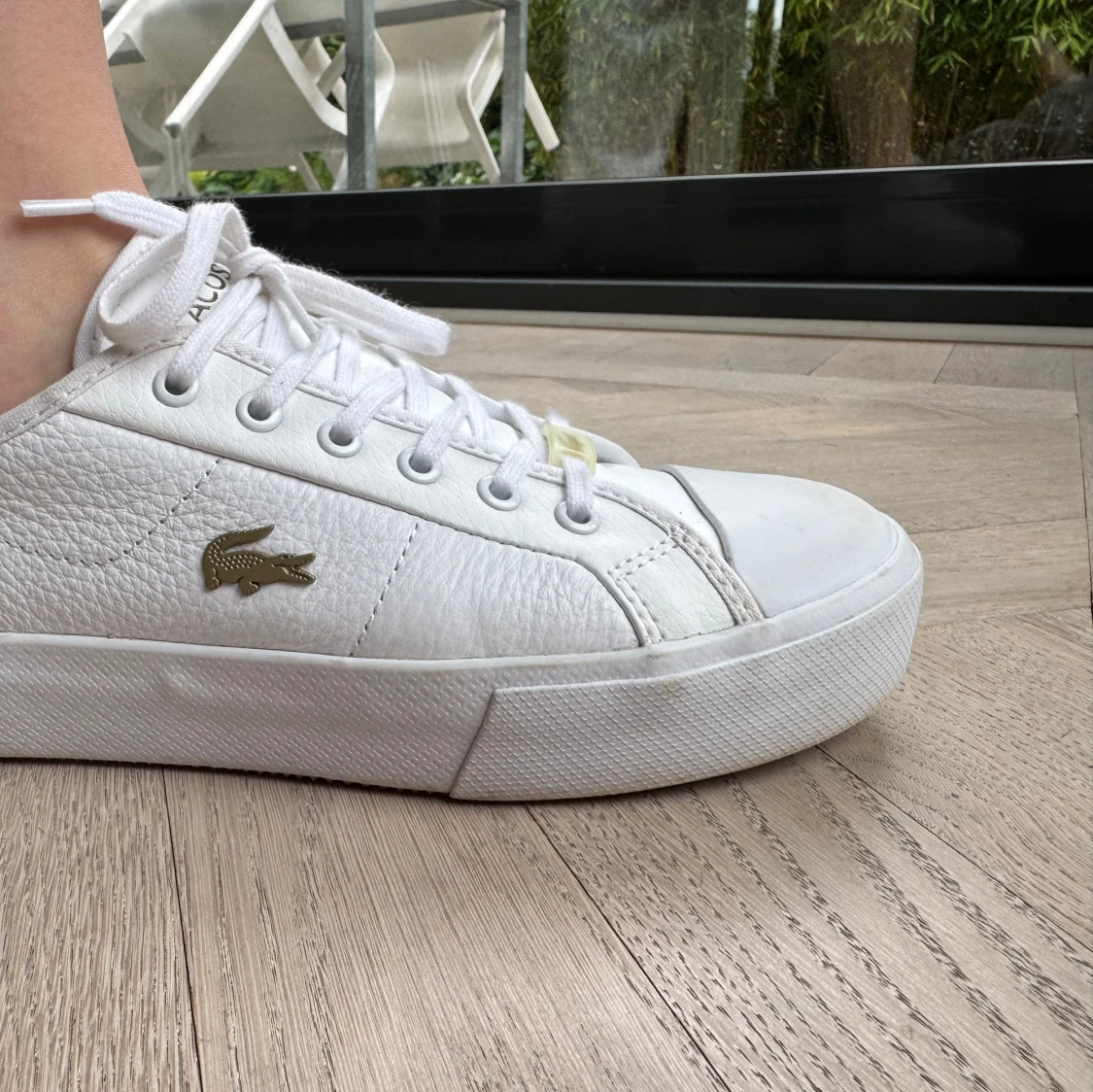 Vita sneakers från Lacoste