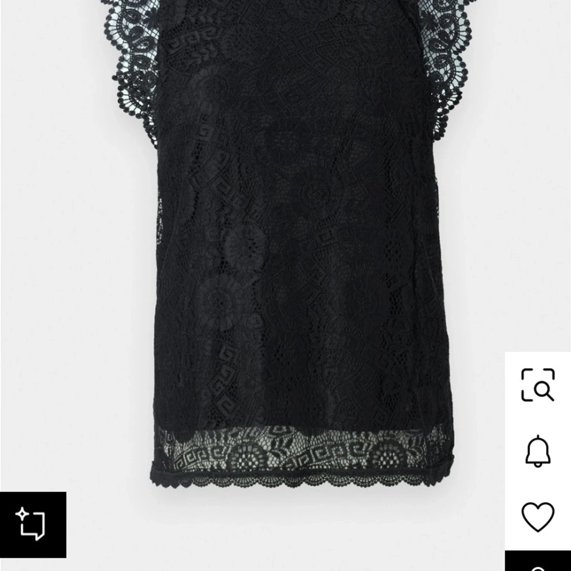 Svart spetsklänning med kort ärm