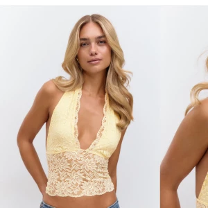 Gul spetsig halterneck-topp - Säljer en ljusgul halterneck-topp i spets med djup v-ringning och öppen rygg. Den är helt ny💕💞Skriv till mig gällande mer frågor💞