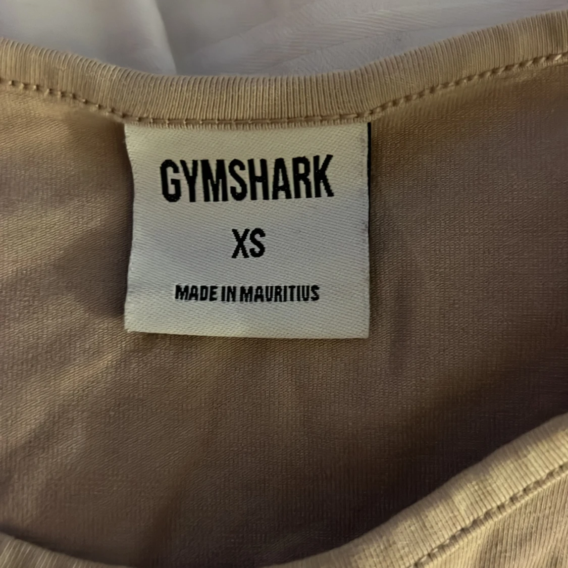 Beige croppad linnetopp från Gymshark - 1