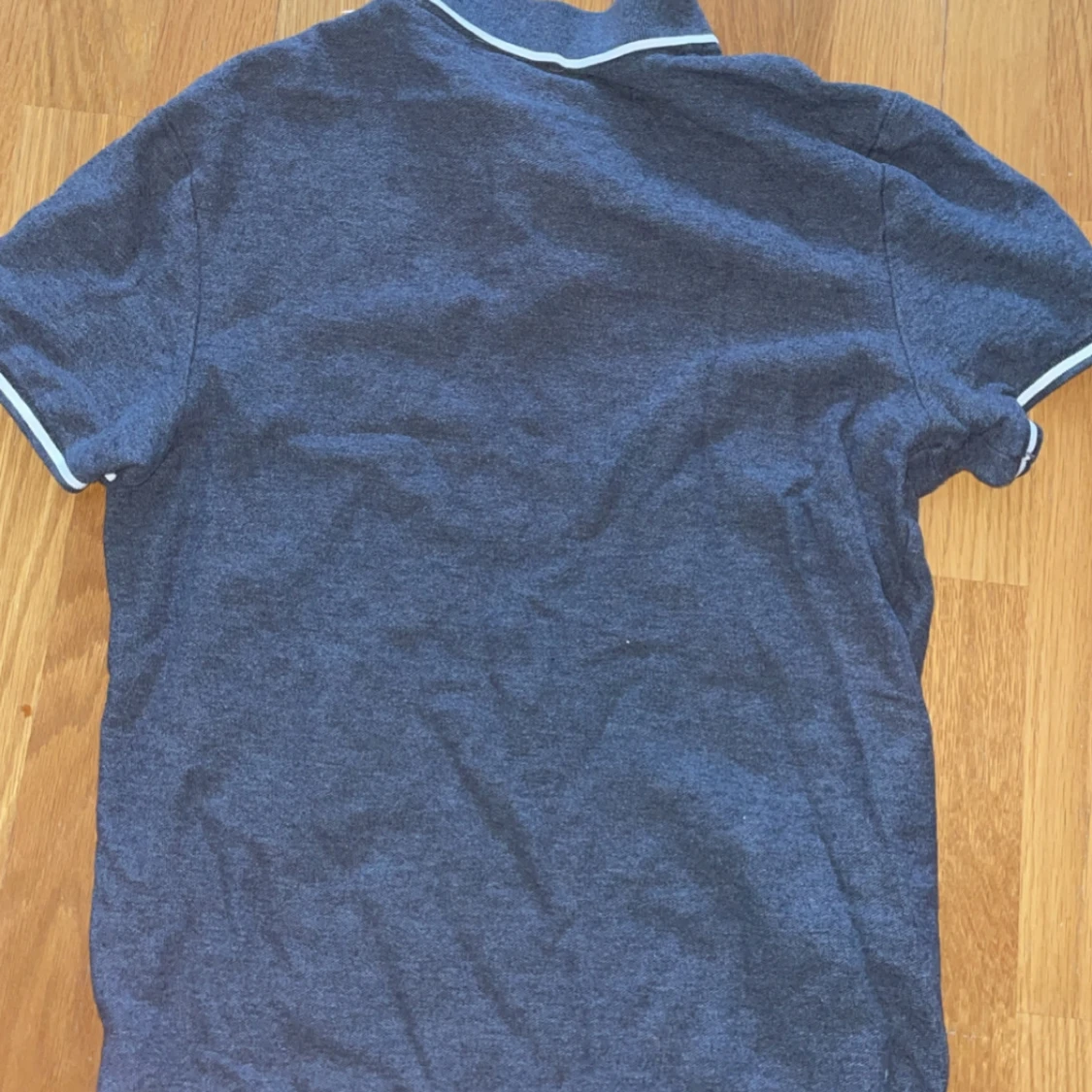 Grå pikétröja från Nike - 1