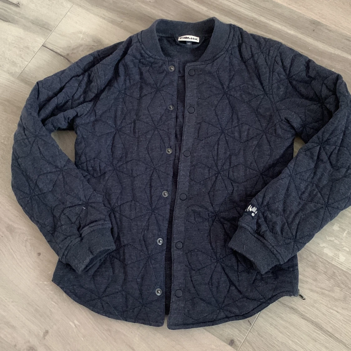 Mörkblå quiltad jacka från Pomp de Lux