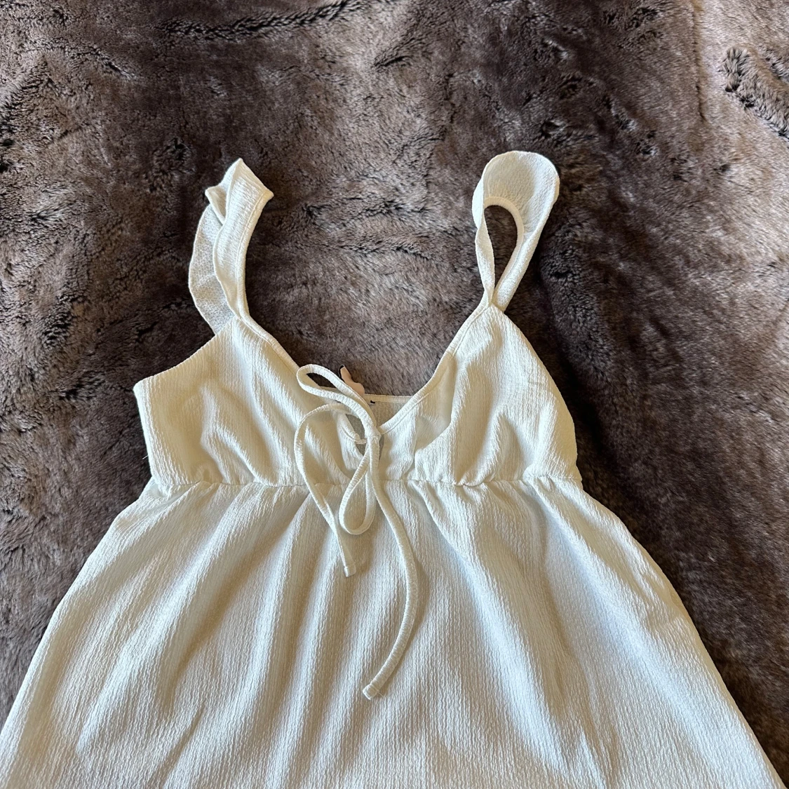 Vit linnetopp från Nelly